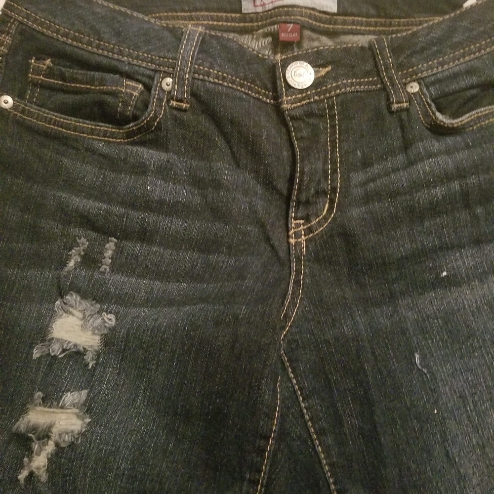 Womens ripped blue jeans